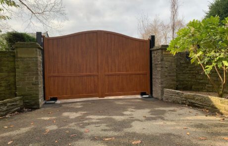 Arch top wooden aluminium gates with wood effect swing driveway