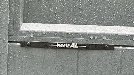 Rain on Aluminium Driveway Gates Horizal Logo